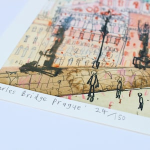 May include: A watercolor painting of Charles Bridge in Prague, with the text 'Charles Bridge Prague' and '24/150' in the bottom right corner.