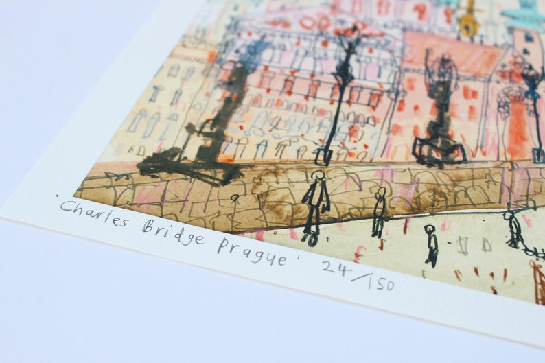 May include: A watercolor painting of Charles Bridge in Prague, with the text 'Charles Bridge Prague' and '24/150' in the bottom right corner.