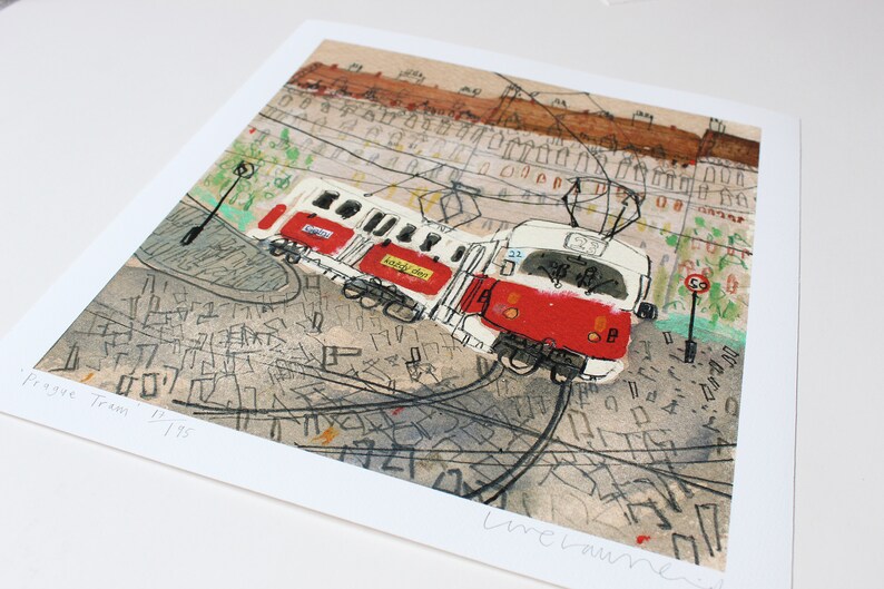 May include: A watercolor painting of a red and white tram with the text "Prague Tram" and "195" on the bottom left corner. The tram is on a street with a background of buildings and a street map.