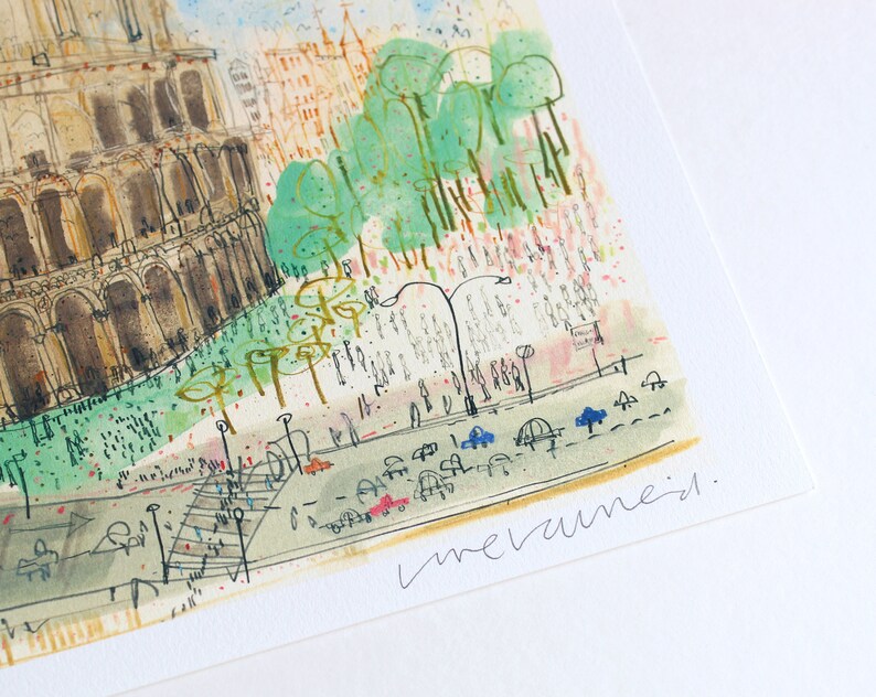 May include: Watercolor painting of a cityscape featuring a large, detailed building with arches, possibly a historical landmark. The artwork includes green trees, a street with cars, and pedestrian figures. The artist's signature is visible.