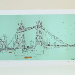 May include: A black and white line drawing of Tower Bridge in London, England. The bridge is drawn against a light blue background with a flock of birds flying overhead. The text "Tower Bridge" and "David Shrigley" are printed below the bridge.