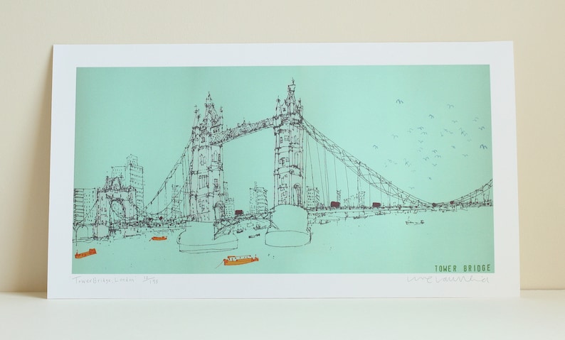 May include: A black and white line drawing of Tower Bridge in London, England. The bridge is drawn against a light blue background with a flock of birds flying overhead. The text "Tower Bridge" and "David Shrigley" are printed below the bridge.
