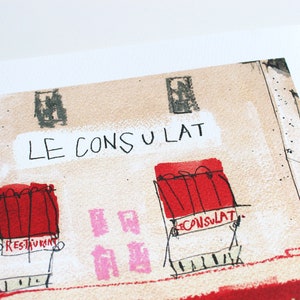 May include: A hand-drawn illustration of a building with the text "LE CONSULAT" above two windows. The windows have red awnings and the text "RESTAURANT" and "CONSULAT" are written on them. The building is painted in shades of brown, red, and pink.