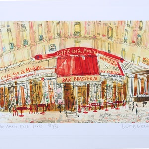 May include: Watercolor print of the "Cafe des 2 Moulins" in Paris, with a red awning and the words "Bar Brasserie." The artwork depicts the cafe's exterior with tables and chairs, and the text "The Amelie Cafe Paris."