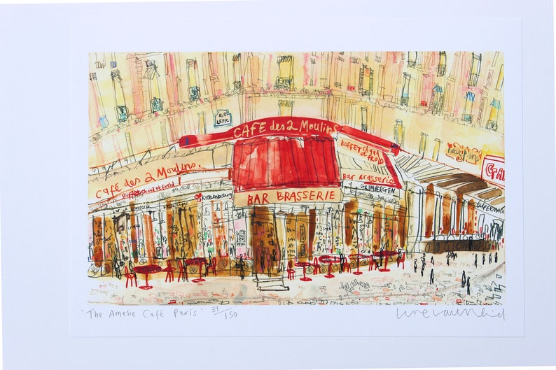 May include: Watercolor print of the "Cafe des 2 Moulins" in Paris, with a red awning and the words "Bar Brasserie." The artwork depicts the cafe's exterior with tables and chairs, and the text "The Amelie Cafe Paris."
