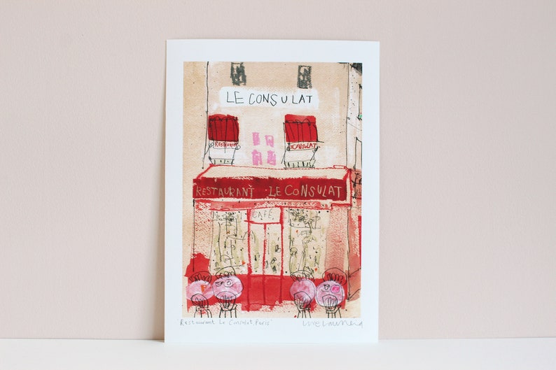 May include: A hand-drawn illustration of a Parisian cafe called "Le Consulat" with red awnings and a red sign that says "Restaurant - Le Consulat". The cafe has a cafe sign and a few tables with chairs outside.