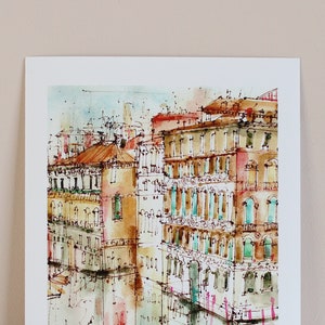 May include: Watercolour painting of a canal in Venice, Italy. The painting features several buildings with colourful facades and windows. The canal is reflected in the water, and there are boats in the distance.