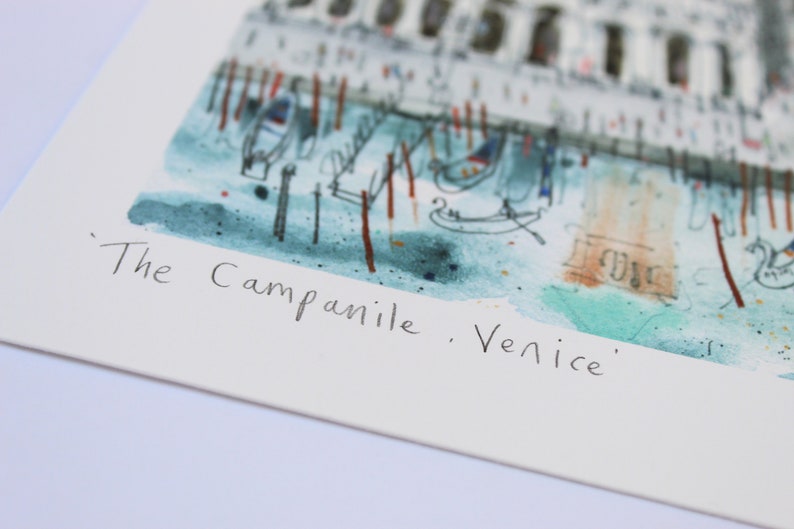 May include: A watercolor painting of the Campanile in Venice, Italy. The painting is in a muted color palette of blues, greens, and browns. The Campanile is depicted in the background, with gondolas and other details in the foreground. The text "The Campanile, Venice" is written in black ink at the bottom of the painting.
