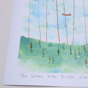 May include: A watercolor print featuring a green grassy hill with stick-figure people and a blue sky filled with small boats and vertical red lines. The text at the bottom reads The Golden Gate Bridge, San. The artwork uses a light color palette.