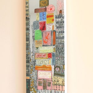 May include: A watercolor painting of a busy city street scene with tall buildings and many signs. The signs include the names of popular brands like Dunkin Donuts, Hershey's, and Planet Hollywood. There are many people walking on the street and yellow taxis.