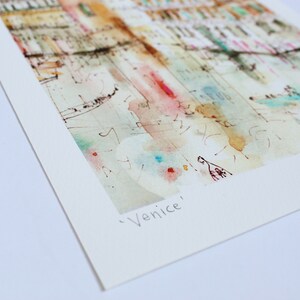 May include: A watercolour painting of a cityscape in a light blue, pink and yellow colour scheme. The painting is titled "Venice".