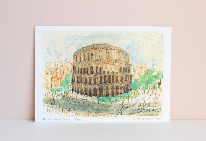 May include: Watercolor print of the Colosseum in Rome. The artwork depicts the ancient amphitheater in shades of brown and beige, with green trees and a blue sky. The print includes the text "The Colosseum Rome" and is numbered 35/150.
