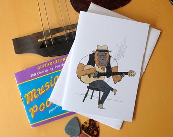 Orangutan guitarist - A6 Greetings Card