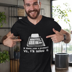 May include: A black t-shirt with a white graphic of a vintage calculator and the text "If there was a problem to, I'll solve it".