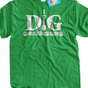 May include: Green t-shirt with white text that says "I DIG GARDENING" with a white shovel graphic in the middle of the word "DIG".