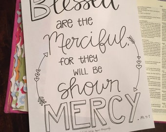 May include: Black and white hand-lettered quote on a white background. The quote reads "Blessed are the Merciful, for they will be shown MERCY. Mt. 5:7".