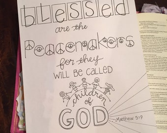 May include: Black and white printable art print with a hand-drawn illustration of children holding hands in a circle around the word "GOD". The text "Blessed are the peacemakers for they will be called children of GOD" is written above the illustration. The text "Matthew 5:9" is written below the illustration. The text "www.leasingketchup.com Copyright 2016 April Roycroft" is written at the bottom of the print.