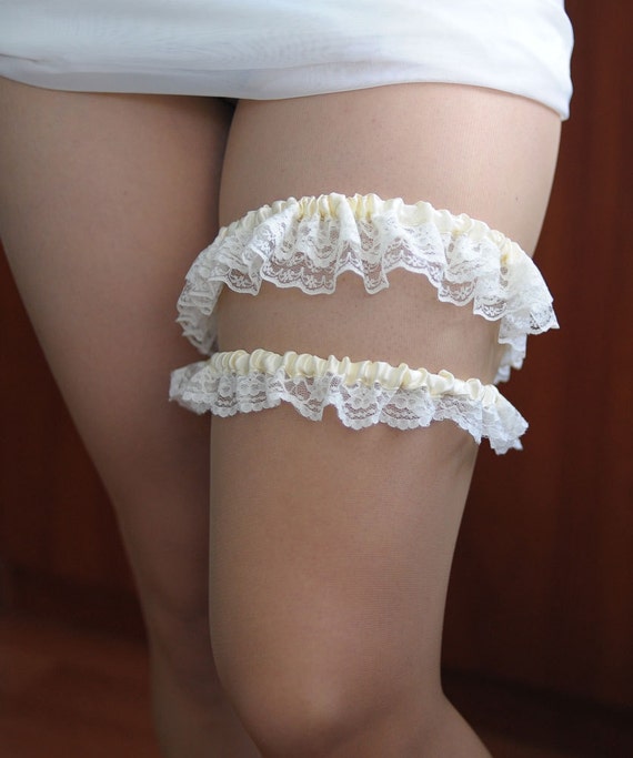 Items similar to Ivory garters Wedding garter set garter ...