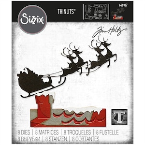 May include: A black metal die cut of Santa Claus in a sleigh pulled by reindeer. The die cut is on a white background with the text "Jim Holtz" and "THINLITS®" in black. The die cut is part of a Sizzix product.