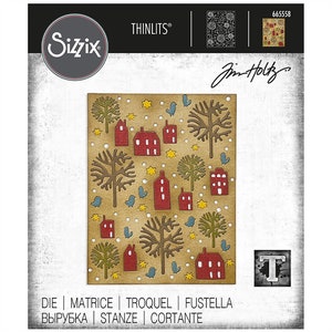 May include: A die-cut craft stencil featuring a winter village scene with red houses, brown trees, blue birds, and yellow stars on a brown background. The stencil is labeled "Thinlits" and "665558" and is by Sizzix and Jim Holtz.