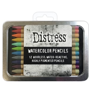 May include: A metal tin containing 12 watercolor pencils. The pencils are woodless, water-reactive, and highly pigmented. The tin is labeled "Distress Watercolor Pencils" and "Ranger".