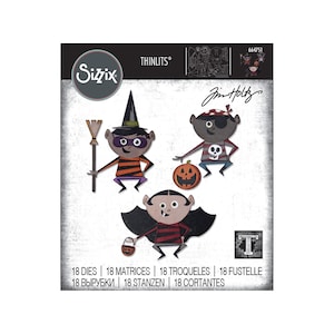 May include: Sizzix Thinlits die set featuring Halloween-themed characters. The set includes a witch with a broom, a pirate with a pumpkin, and a vampire with a candy basket. The package includes 18 dies. The text "Jim Holtz" is also visible.