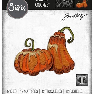 May include: Two orange pumpkins with a dripping glaze design. The pumpkins are die-cut and have a textured surface. The image includes the text "THINLITS® COLORIZE®" and "Jim Holtz".