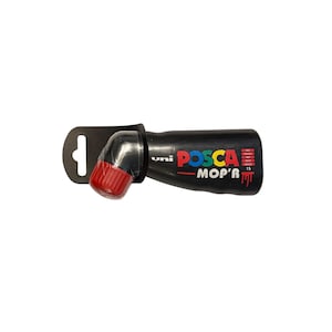 May include: Black POSCA MOP'R 15 paint marker with a red cap and a black handle. The marker has the words "uni POSCA MOP'R 15" printed on the side in multiple colors. The marker has a black hanging tab.