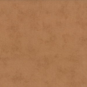 May include: A solid brown fabric with a subtle texture. The fabric has a slightly rough feel and a warm, earthy tone.