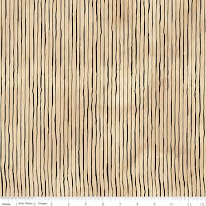 May include: Fabric with a beige background and vertical black lines. The lines are uneven and create a textured appearance. The fabric is measured in inches, with a ruler at the bottom.