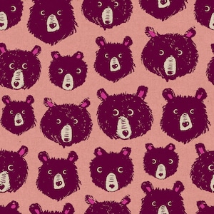 May include: A seamless pattern featuring a repeating design of burgundy bear faces on a light pink background.