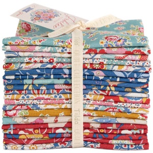 May include: A stack of floral fabric squares in various colors, including blue, red, yellow, and pink, tied with a cream ribbon. A tag with floral designs and the word "Jubilee" is attached. The fabric is likely for quilting or other craft projects.