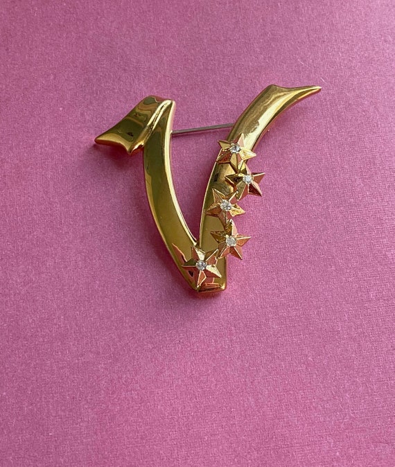Initial brooch on sale