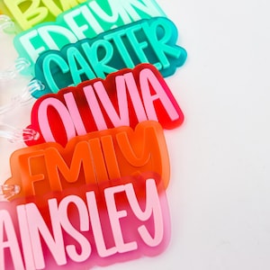 a group of plastic name tags sitting on top of a table