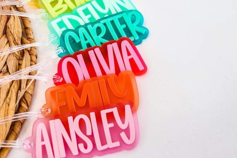 a group of plastic name tags sitting on top of a table