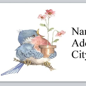 May include: A bluebird with a pink breast holds a small terracotta pot with pink flowers. The text "Name Address City, State Zip" is below the bird.