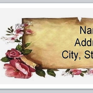 May include: A vintage-style scroll with a floral design, featuring pink roses and white flowers. The scroll has the text "Name Address City, State Zip" written on it.