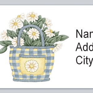 May include: A blue and yellow checkered tote bag with a white daisy design. The bag is filled with white daisies and green leaves. The text "Name Address City, State Zip" is printed on the right side of the image.