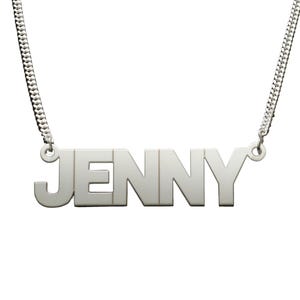 May include: Silver necklace with a nameplate pendant that reads "JENNY".