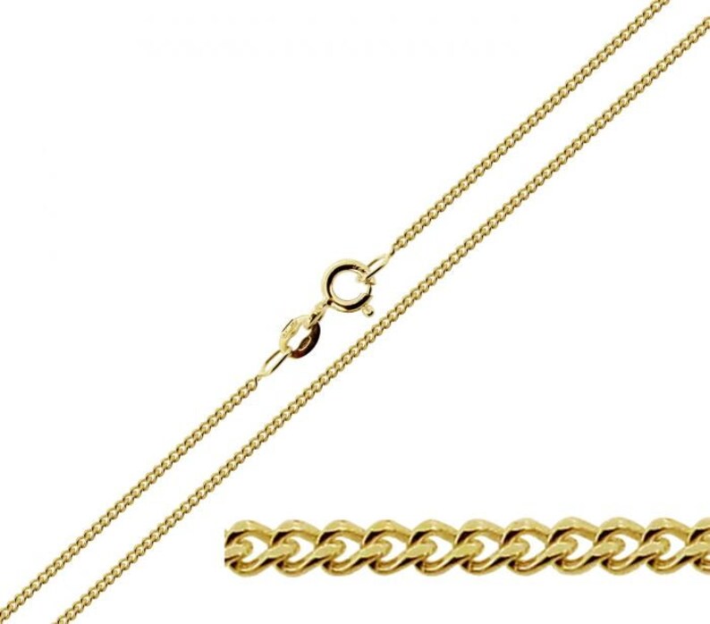 May include: A gold curb chain necklace with a lobster clasp closure. The chain is made of a durable metal and is perfect for everyday wear.
