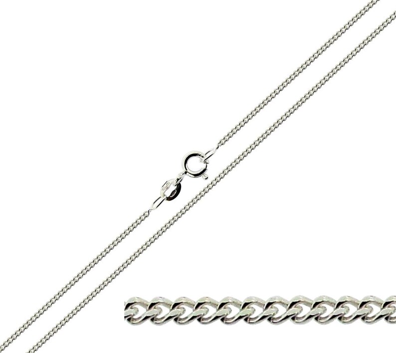 May include: A silver curb chain necklace with a lobster clasp.