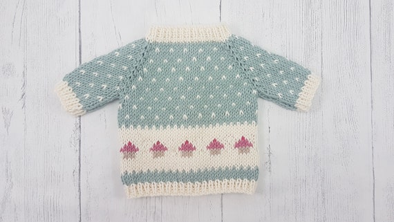 REALLY CUTE ..SIZE 1. NEW HANDKNITTED JUMPER CUP CAKE..