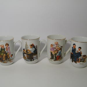 4 Norman Rockwell Collector Mugs with gold accent rim, Vintage collection of 8 ounce mugs from Rockwell Museum Collection, Gently used