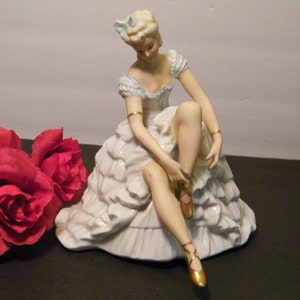 Gorgeous Porcelain Ballerina Sitting Tying shoe Figurine, Made in Germany  with back stamp Crown over HYS, No Chips or cracks, collectible