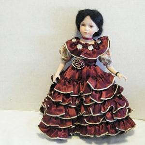 Vintage Porcelain Doll from Emerald Doll Collection Rosita 17 inch tall collectible, comes with stand, Red ruffled dress with Rose accents