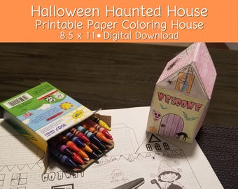 May include: Printable Halloween haunted house coloring page. The house is 8.5 inches by 11 inches and is a digital download. The image shows a partially assembled house with a welcome sign and a box of crayons.