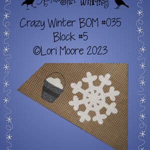 May include: A brown and white gingham fabric with a white snowflake and a gray bucket with white snow inside. The fabric is in the shape of a triangle and is surrounded by a blue background with a white dotted border. The text "Homespun Whimsy" is at the top of the image, and the text "Crazy Winter BOM #035 Block #5 Lori Moore 2023" is below the fabric.