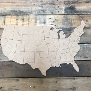 May include: A wooden cutout of the United States map with state borders outlined. The map is on a rustic wooden background.
