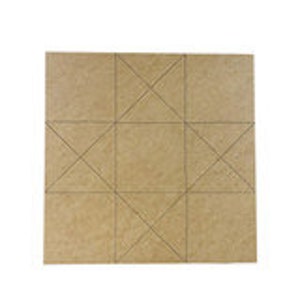May include: A square piece of beige fabric with a pattern of lines forming a star shape in the center.