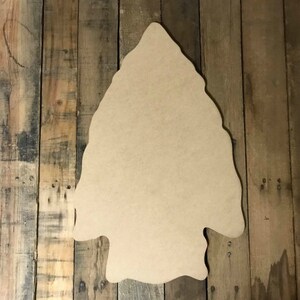 May include: A large, unfinished wooden arrowhead shape, perfect for crafting and decorating.